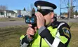 Peace officer holding radar gun